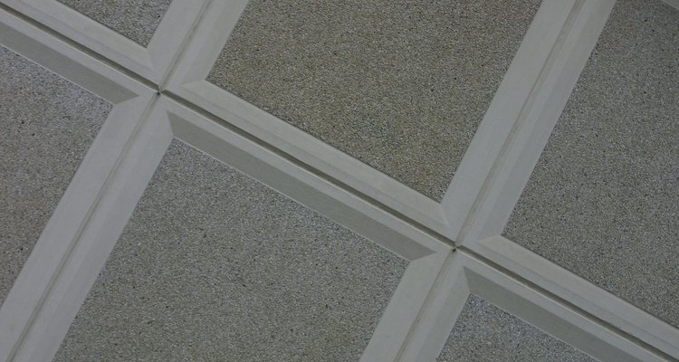 Suspended ceilings hang below joists and leave a gap at stairways.