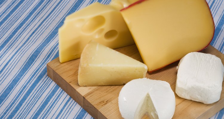 Variety of cheeses on cutting board