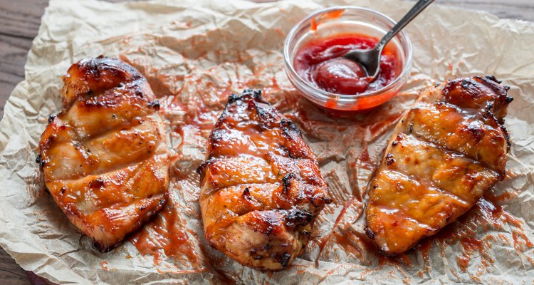 Grilled chicken breasts in hot mango sauce