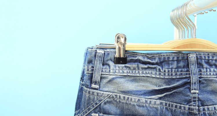 Close-up of jeans on a rack