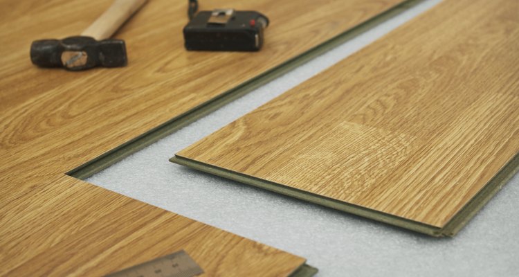 Seal the joins between laminate planks with glue.