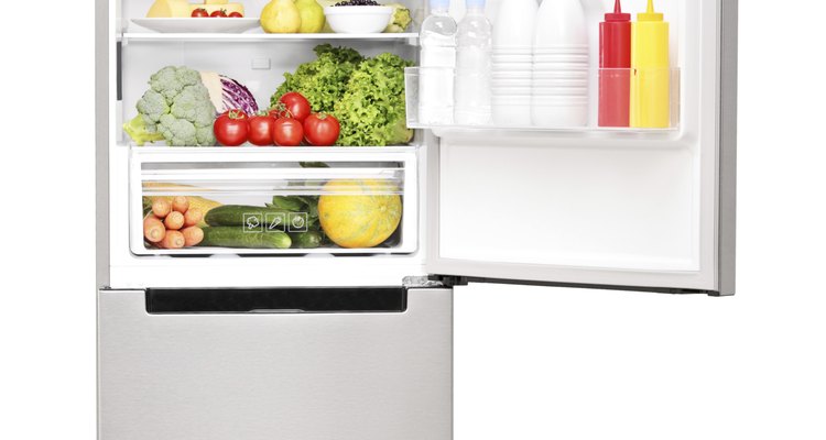 The thermostat is commonly located inside the upper rear of the refrigerator compartment.