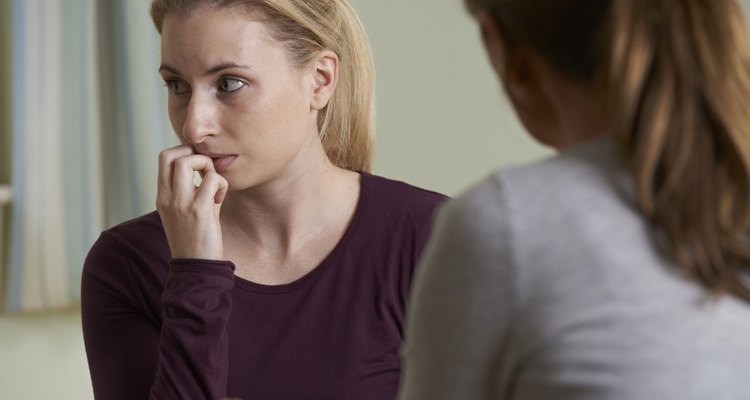 Young Woman Discussing Problems With Counselor