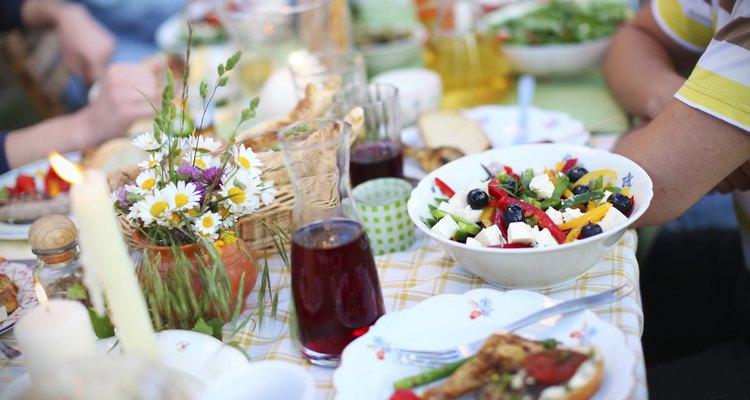 Greek salad, olives and feta cheese, picnic table with food