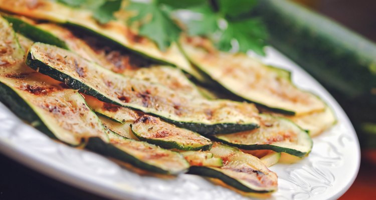 Grilled zucchini on a white plate