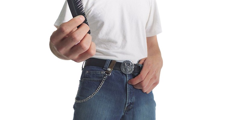 photo caricature of a 50s era greaser in jeans and a t-shirt as he prepares to comb his hair