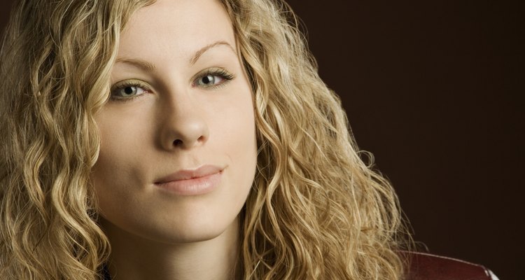 Woman with long blond curly hair