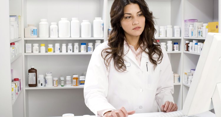 Pharmacist using computer