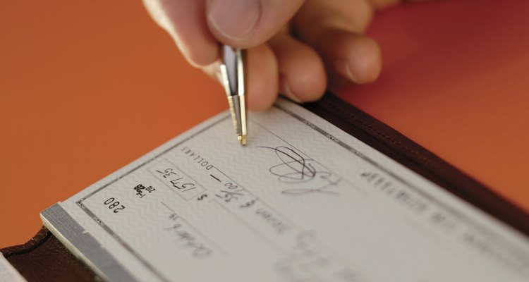 Man writing check