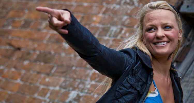 Blonde in leather jacket, pointing