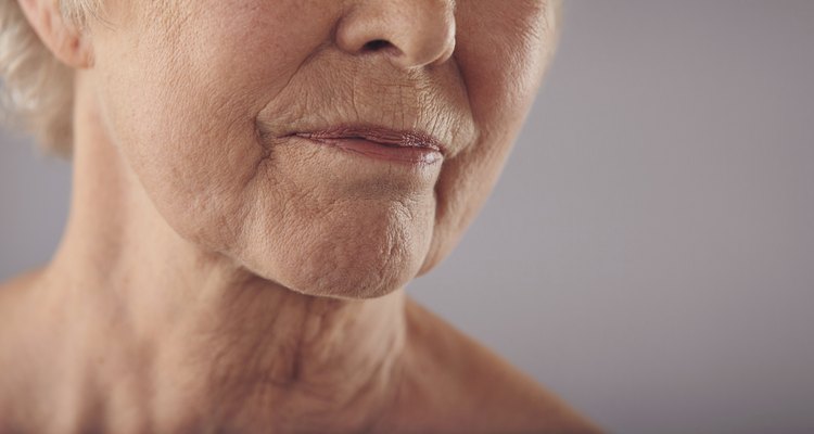 Senior female face with wrinkled skin