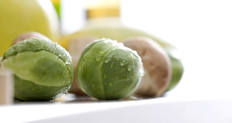 Brussels sprouts and mushrooms on a kitchen counter