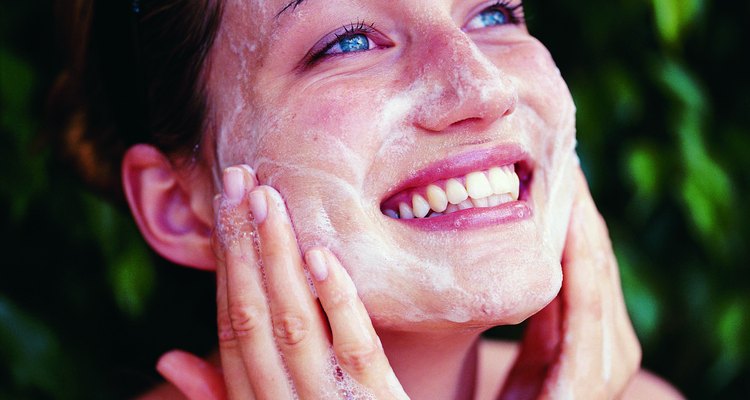 Woman Washing Face with a Sponge