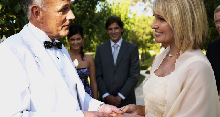 Bride and groom holding hands at wedding