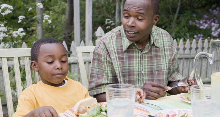 Mid adult man and his son having breakfast