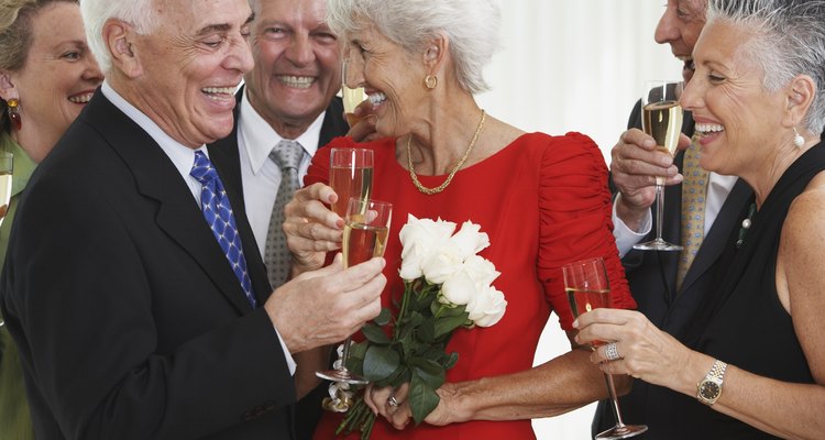 Senior friends drinking champagne at party