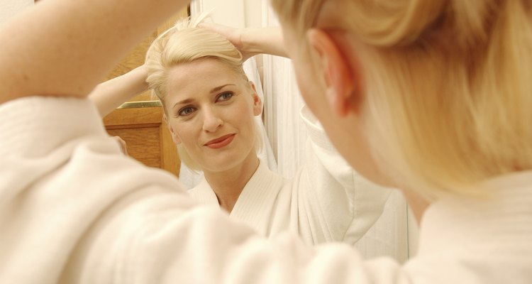 Woman looking into mirror