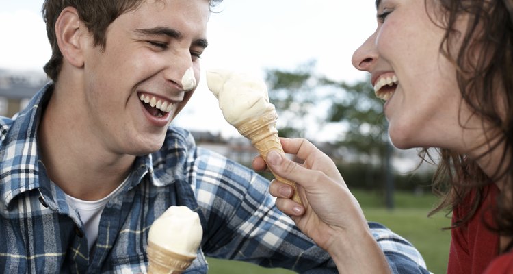 Couple playing with ice cream cones
