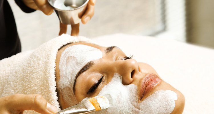 Woman receiving facial treatment at spa
