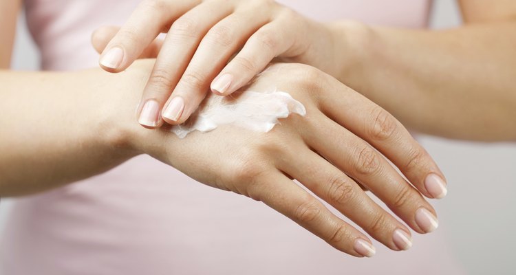 beautiful woman hands with cream