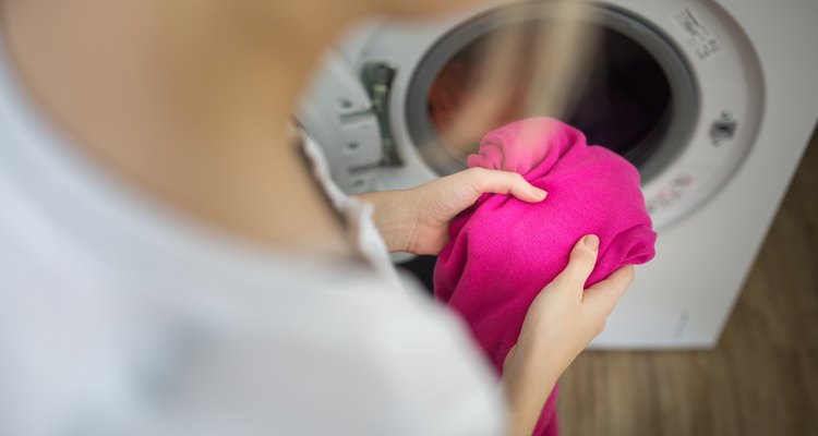 Young woman doing laundry