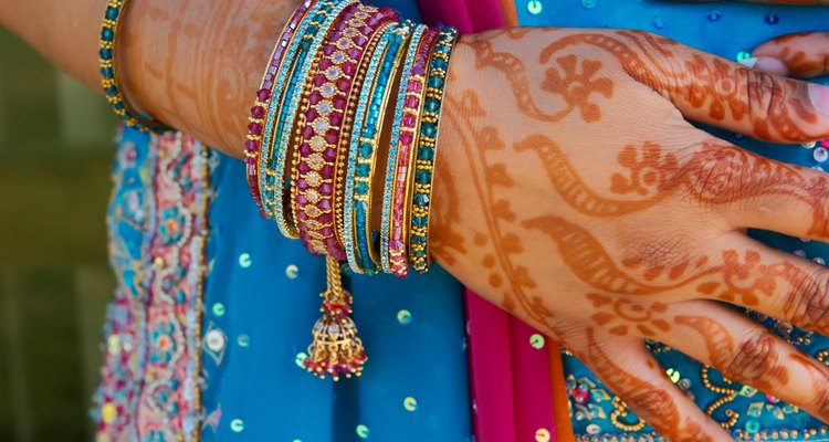 Indian wedding bride getting henna applied