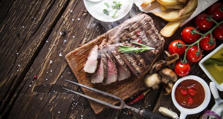 Beef steak on wooden table