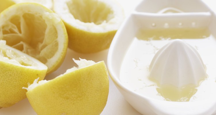 Lemon halves by juice squeezer, close-up