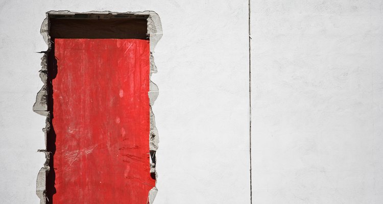 Fill in cracks with insulating foam and then paint it.
