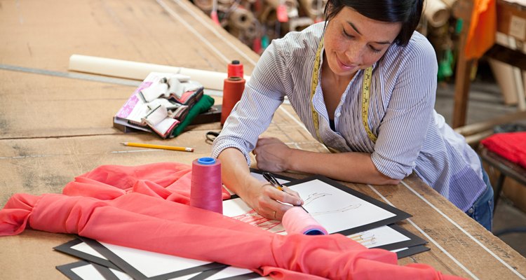 Woman drawing pattern from fabric