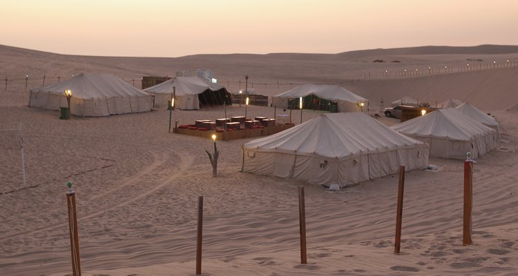 Pillows in solid colours and lush fabrics are the finishing touch to an Arabian tent.