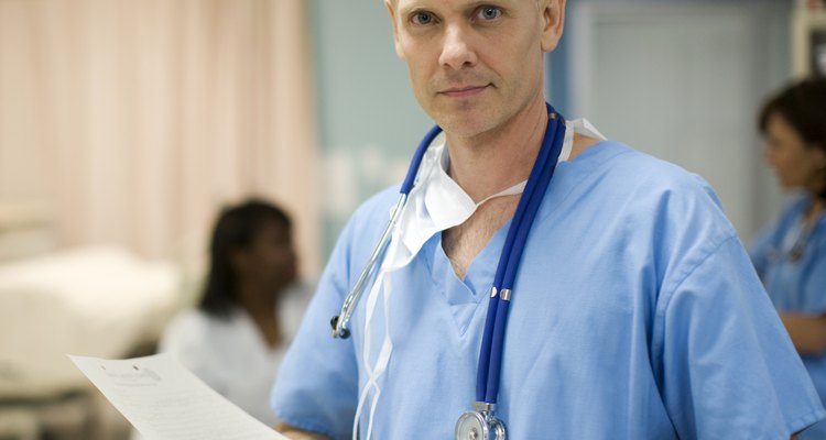 Doctor holding medical records in hospital, portrait