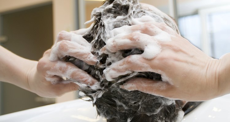 Hairdresser washing hair