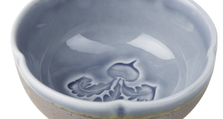 It is possible to remove a stuck plate from a ceramic bowl without damaging it.