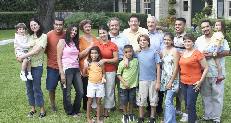 Portrait of a three generation family standing in a garden