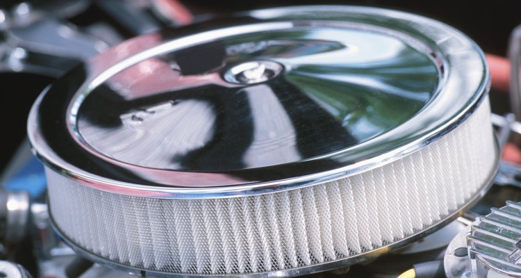 Though cars often have large, open air filters, motorcycles enclose them in a box to concentrate airflow onto their smaller surface area.