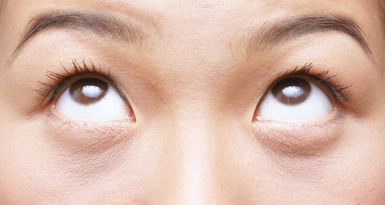 Lightening tattooed eyebrows gives a more natural result.