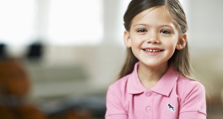 Girl (4-6) smiling, portrait, close-up