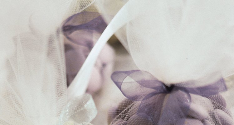 Tulle looks attractive wrapped around small, colourful wedding gifts.