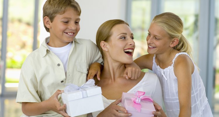 Mother receiving presents from son and daughter