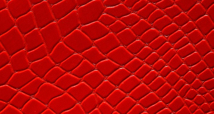 Use a grid stencil to create the snakeskin effect with spray paint.