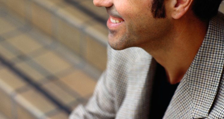 Profile of a Smiling Man Sitting on Stairs