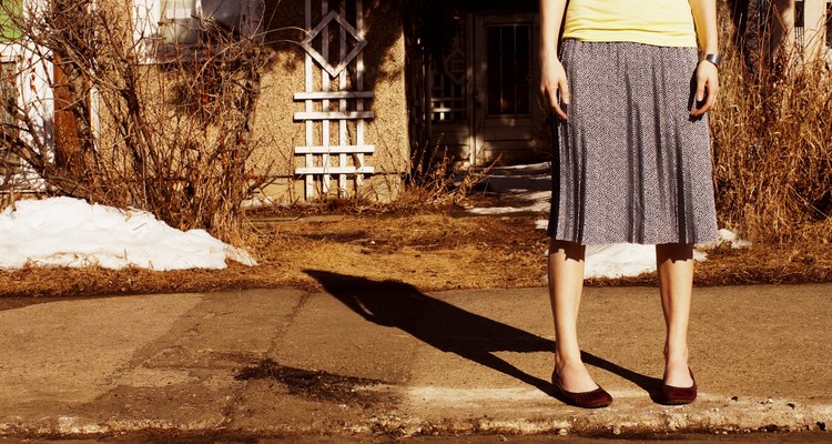 Woman waiting on the curb