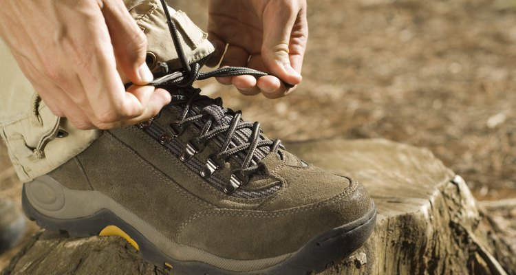 Hands tying shoe