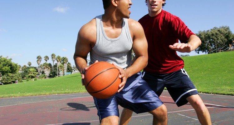 Men playing basketball