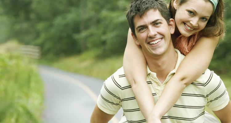 Man carrying woman on his back