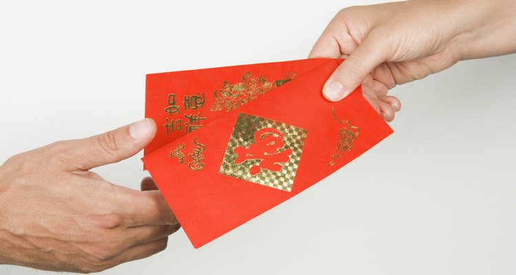 People giving Chinese money envelopes