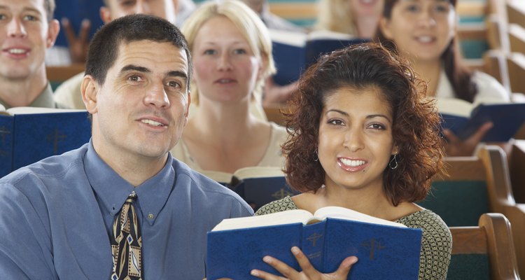 Couple in congregation with hymnal