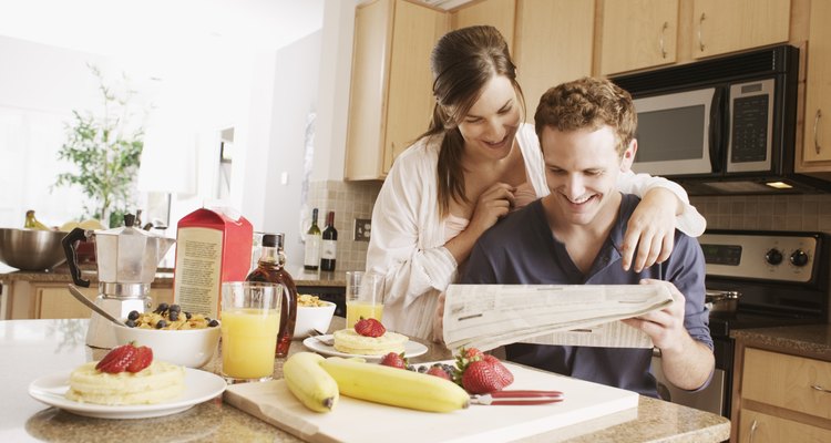 Couple reading newspaper