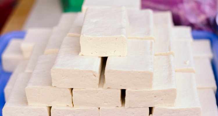 white bricks of fresh tofu on asian market